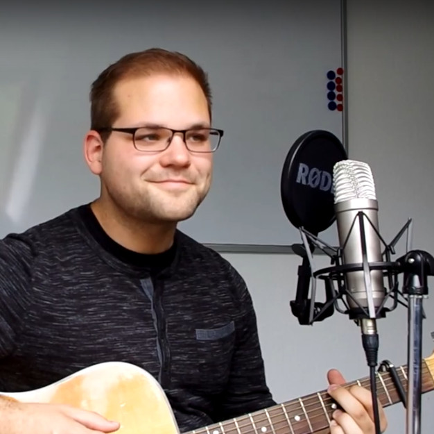 A screenshot of a YouTube video, where I perform a song with the acoustic guitar